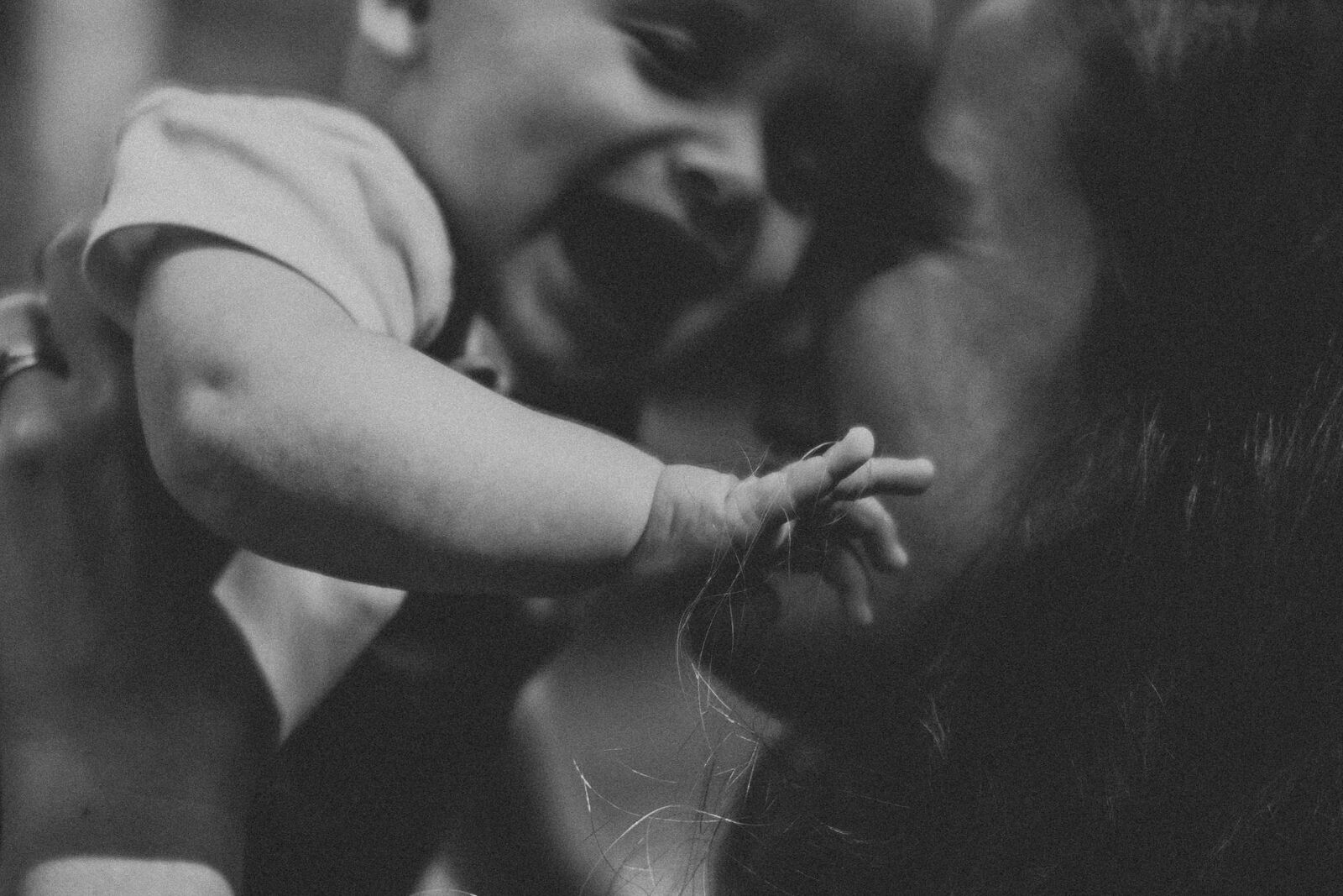 Mum and baby cuddling and laughing